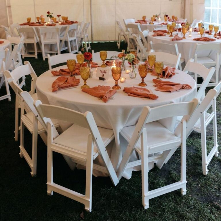 Round tables dressed in linens with rust napkins